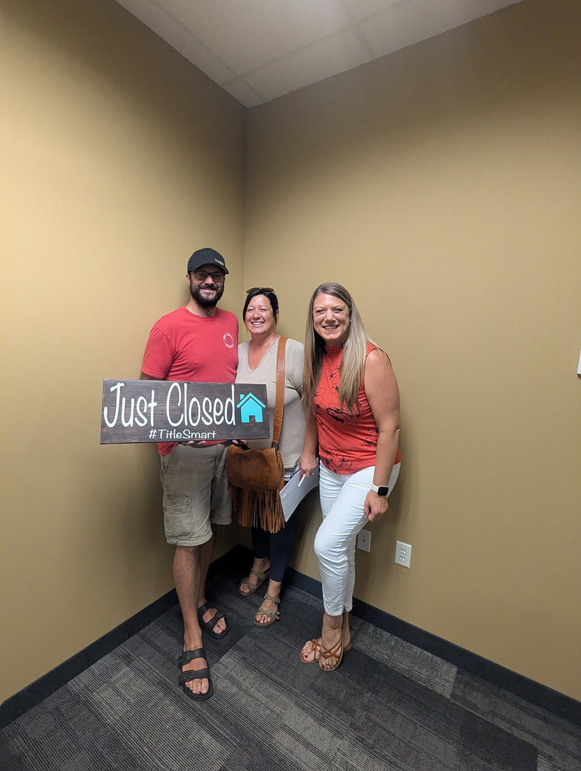 Candice with clients on closing day