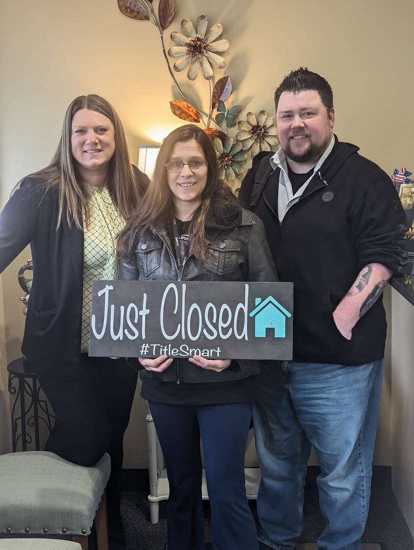 Candice with clients on closing day